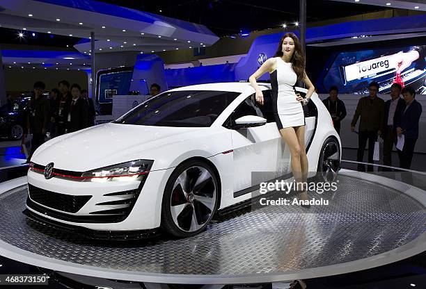 Models pose next to a Volkswagen Golf GTI at the Seoul Motor Show 2015 at KINTEX on April 02, 2015 in Seoul, South Korea. Kim Jong Hyun / Anadolu...