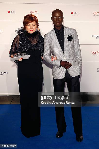 Papis Loveday and guest arrive for the Cinema For Peace 2014 - Gala at Konzerthaus Am Gendarmenmarkt on February 10, 2014 in Berlin, Germany.