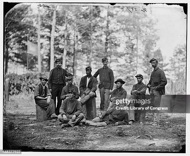 In this image from the U.S. Library of Congress, Union soldiers from Company D, U.S. Engineer Battalion, pose during the siege in August, 1864 in...