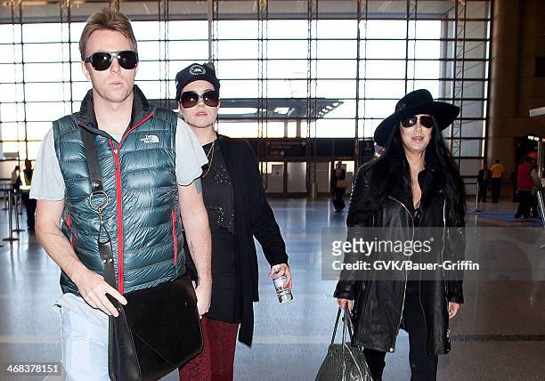 Cher and her son Elijah Blue Allman is seen at LAX on December 10, 2012 in Los Angeles, California.
