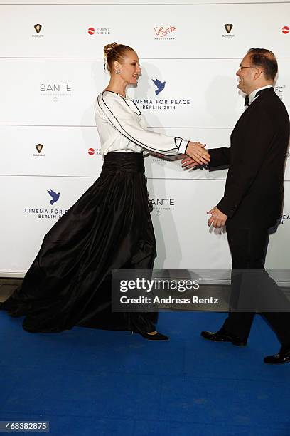 Uma Thurman and Jaka Bizilj arrive for the Cinema For Peace 2014 - Gala at Konzerthaus Am Gendarmenmarkt on February 10, 2014 in Berlin, Germany.