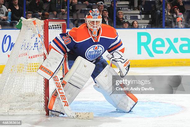 Ben Scrivens of the Edmonton Oilers prepares to make a save during the game against the Columbus Blue Jackets on March 18, 2015 at Rexall Place in...