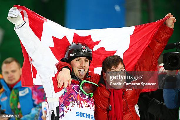 Gold medalist Alex Bilodeau of Canada celebrates with his brother Frederic after the flower ceremony for the Men's Moguls Finals on day three of the...