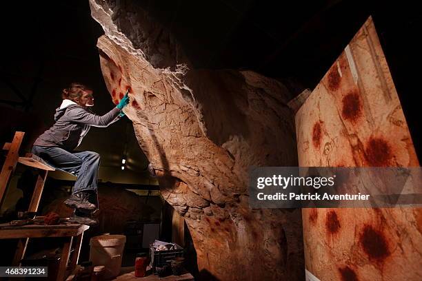In the studio,conservationists and artists of Arc and OS work on the full-size reproduction of Chauvet cave, an underground environment identical to...