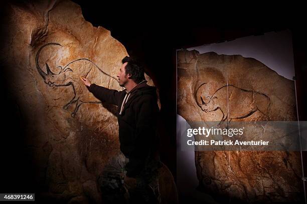 In a studio an artist works on the full-size reproduction of the Chauvet cave, an underground environment identical to the original that contains the...