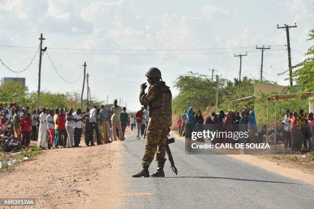 Kenya Defence Forces soldier stands guard before they ended a siege by gunmen in the university campus of the northeastern town of Garissa on April...