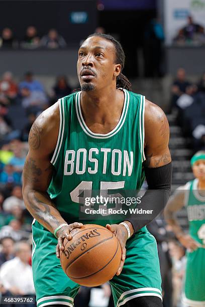 Gerald Wallace of the Boston Celtics attempts a free throw shot against the Charlotte Hornets on March 30, 2015 at Time Warner Cable Arena in...