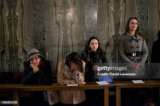 Catholics pray at a Maundy Thursday Mass where Cardinal Vincent Nichols washed the feet of a group of Chelsea Pensioner's at the Mass of the Lord's...