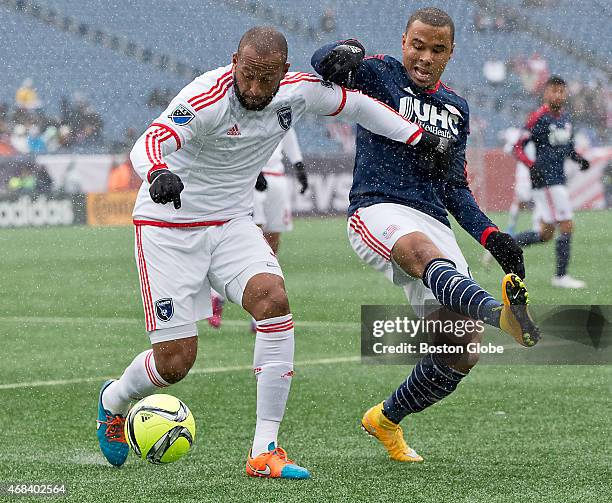 The New England Revolution's Charlie Davies pressures the San Jose Earthquakes' Victor Bernardez during first half action at Gillette Stadium on...