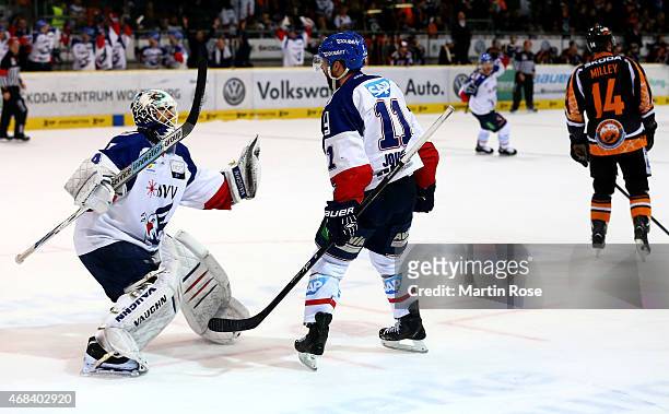 Andrew Joudrey of Mannheim celebrate with team mate Dennis Endras after he scores his team's game winning goal in game four of the DEL semi final...
