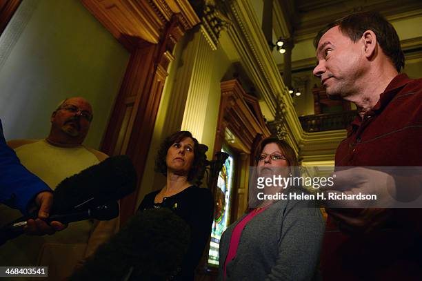Tom Mauser, right, who's son Daniel Mauser was killed at Columbine High School, speaks to members of the media during a press conference with other...