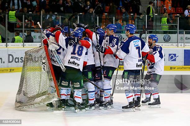 Players of Mannheim celebrate after winning in game four of the DEL semi final play-offs between Grizzly Adams Wolfsburg at BraWo Ice Arena on April...