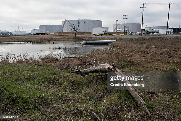 Water retention pond stands near oil storage tanks at the Enbridge Inc. Cushing storage terminal in Cushing, Oklahoma, U.S., on Wednesday, March 25,...