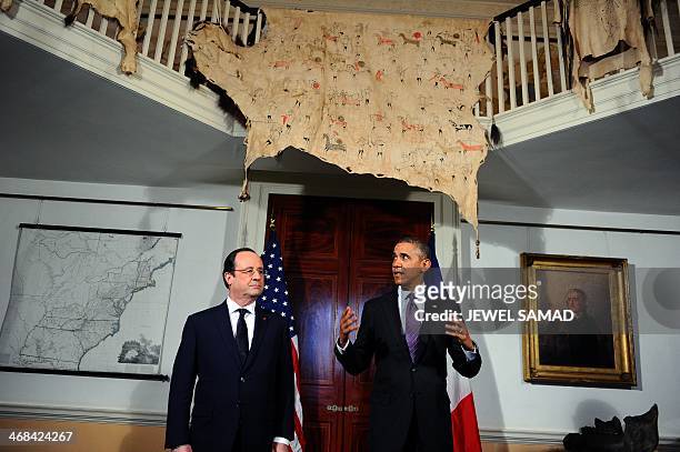 President Barack Obama makes a statement to the media as his French counterpart Francois Hollande listens followoing their tour of the Third US...