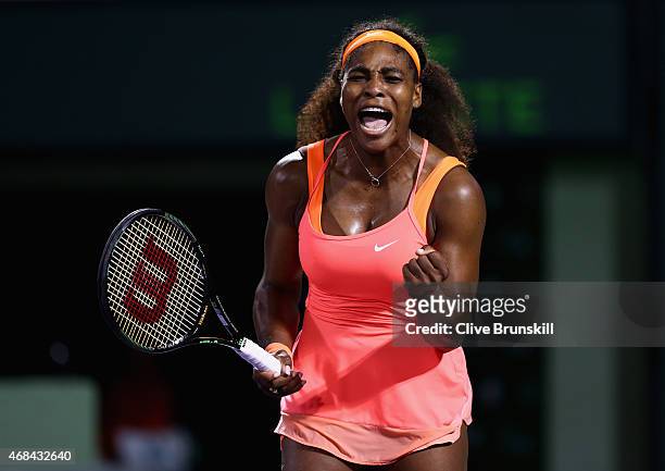 Serena Williams of the United States celebrates a point against Simona Halep of Romania in their semi final match during the Miami Open Presented by...