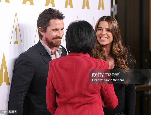 Actor Christian Bale, Academy of Motion Picture Arts and Sciences Board of Governors President Cheryl Boone Isaacs, and Sibi Blazic attend the 86th...