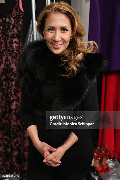 Designer Reem Acra prepares backstage at the Reem Acra fashion show during Mercedes-Benz Fashion Week Fall 2014 at The Salon at Lincoln Center on...