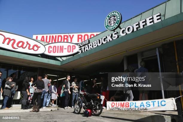 The line outside Dumb Starbucks stretches half way around the block with customers waiting roughly 2.5 hours for a free coffee in the Los Feliz...