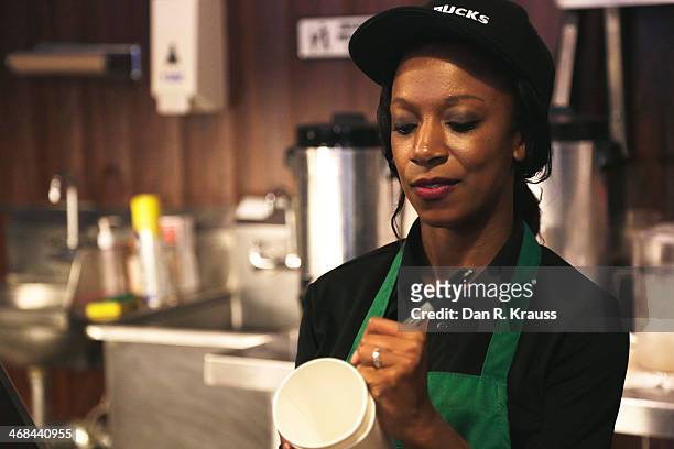 One of the two baristas working inside of Dumb Starbucks marks a cup in the Los Feliz neighborhood on February 10, 2014 in Los Angeles, California....