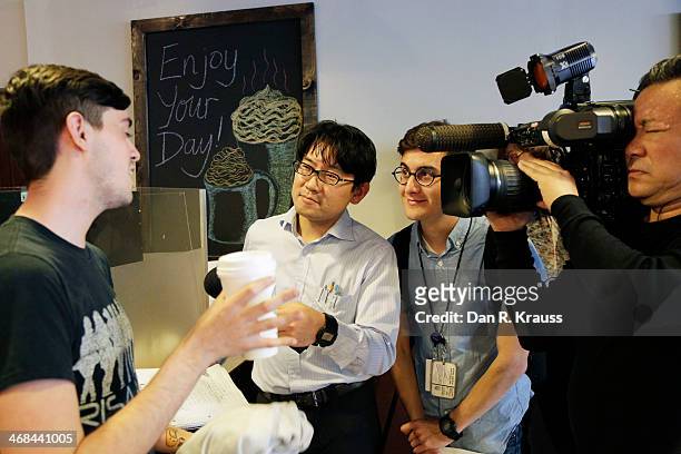 Customer Daniel Todd is interviewed for Nippon Television after waiting 2.5 hours for a free coffee in the Los Feliz neighborhood on February 10,...