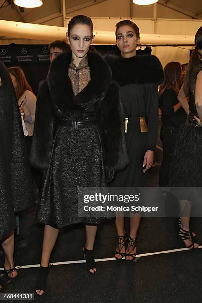 Model prepare backstage at the Reem Acra fashion show during Mercedes-Benz Fashion Week Fall 2014 at The Salon at Lincoln Center on February 10, 2014...