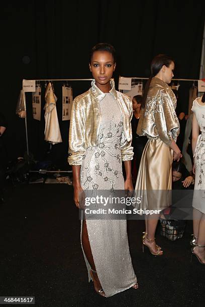 Model prepares backstage at the Reem Acra fashion show during Mercedes-Benz Fashion Week Fall 2014 at The Salon at Lincoln Center on February 10,...