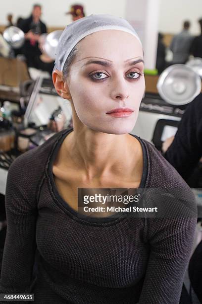 Model prepares before the Thom Browne Women's show during Mercedes-Benz Fashion Week Fall 2014 at Center 548 on February 10, 2014 in New York City.