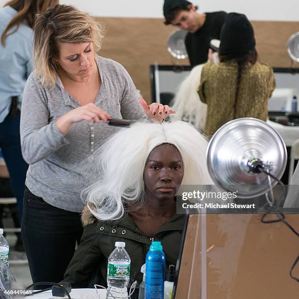 Model prepares before the Thom Browne Women's show during Mercedes-Benz Fashion Week Fall 2014 at Center 548 on February 10, 2014 in New York City.