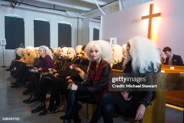 Models prepare before the Thom Browne Women's show during Mercedes-Benz Fashion Week Fall 2014 at Center 548 on February 10, 2014 in New York City.