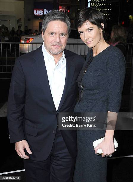 Chairman and CEO of Paramount Pictures Brad Grey and his wife Cassandra Huysentuyt arrive at the Los Angeles Premiere 'Jack Ryan: Shadow Recruit" on...