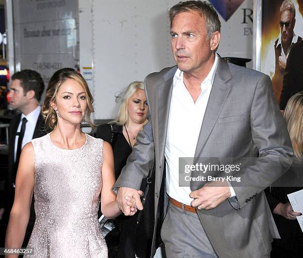 Actor Kevin Costner and wife Christine Baumgartner arrive at the Los Angeles Premiere 'Jack Ryan: Shadow Recruit" on January 15, 2014 at TCL Chinese...