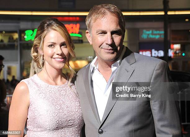 Actor Kevin Costner and wife Christine Baumgartner arrive at the Los Angeles Premiere 'Jack Ryan: Shadow Recruit" on January 15, 2014 at TCL Chinese...