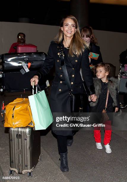 Jessica Alba and her daughter Honor Marie Warren are seen at LAX on December 06, 2012 in Los Angeles, California.