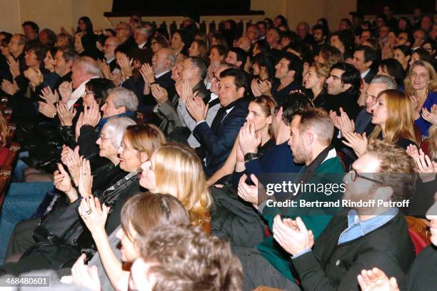 Public applauds at the end of 'La Porte a Cote' : Theater Play premiere. Held at Theatre Edouard VII on February 10, 2014 in Paris, France.