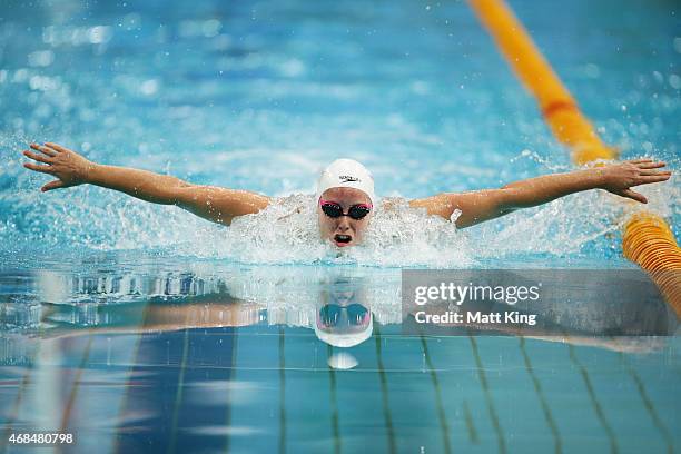 Alicia Coutts competes in the Women's 100m Butterfly Semi Final during day one of the Australian National Swimming Championships at Sydney Olympic...