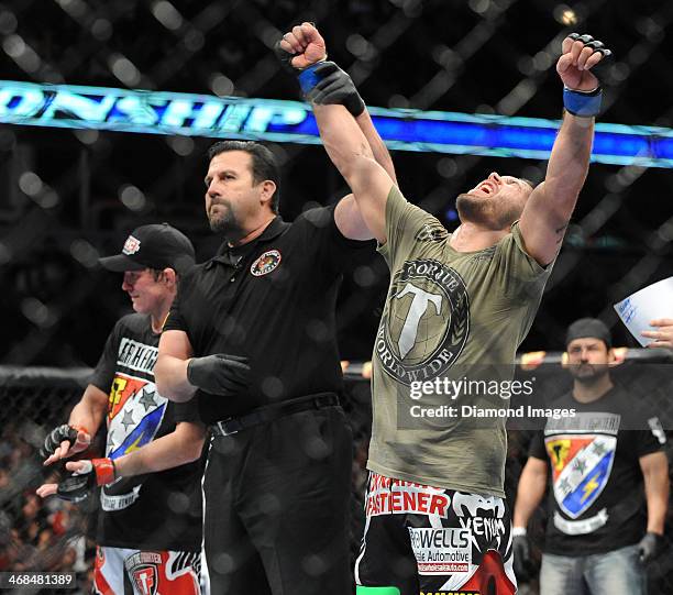 Jeremy Stephens celebrates while having his arm raised in victory after a featherweight bout during UFC on Fox 10 Henderson v Thomson at United...