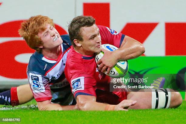 Jake Schatz of the Reds scores a try during the round eight Super Rugby match between the Rebels and the Reds at AAMI Park on April 3, 2015 in...
