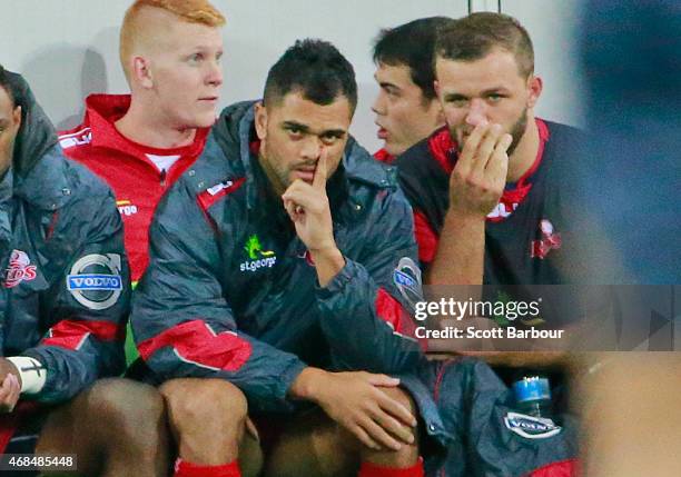 Karmichael Hunt of the Reds looks on from the bench during the round eight Super Rugby match between the Rebels and the Reds at AAMI Park on April 3,...