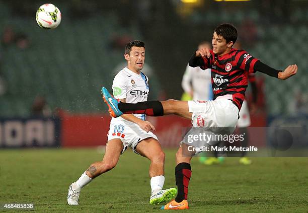 Labinot Haliti of the Wanderers is challenged by Robert Koren of Melbourne City during the round 24 A-League match between the Western Sydney...