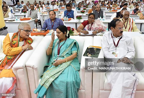 Senior leaders of India's Bharatiya Janata Party Murali Manohar Joshi, Sushma Swaraj and Venkaiah Naidu look on during a BJP National Executive...