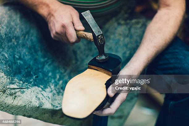unrecognizable shoemaker at work. - shoemaker stock pictures, royalty-free photos & images