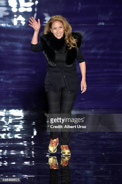 Designer Reem Acra walks the runway at the Reem Acra fashion show during Mercedes-Benz Fashion Week Fall 2014 at The Salon at Lincoln Center on...