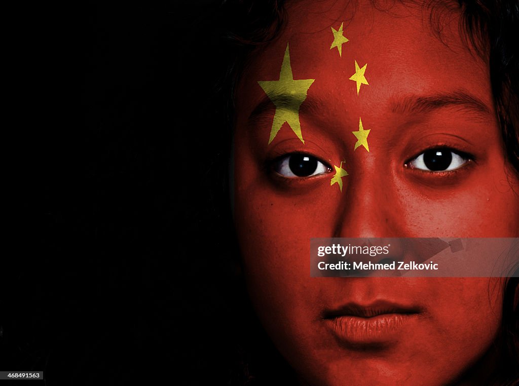 Girl with national flag on her face