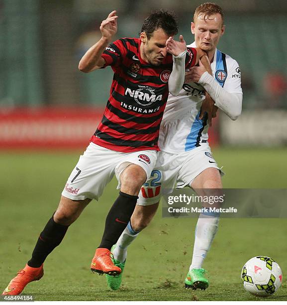 Labinot Haliti of the Wanderers and Jack Clisby of Melbourne compete for the ball during the round 24 A-League match between the Western Sydney...