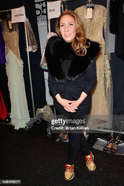 Designer Reem Acra prepares backstage at the Reem Acra fashion show during Mercedes-Benz Fashion Week Fall 2014 at The Salon at Lincoln Center on...
