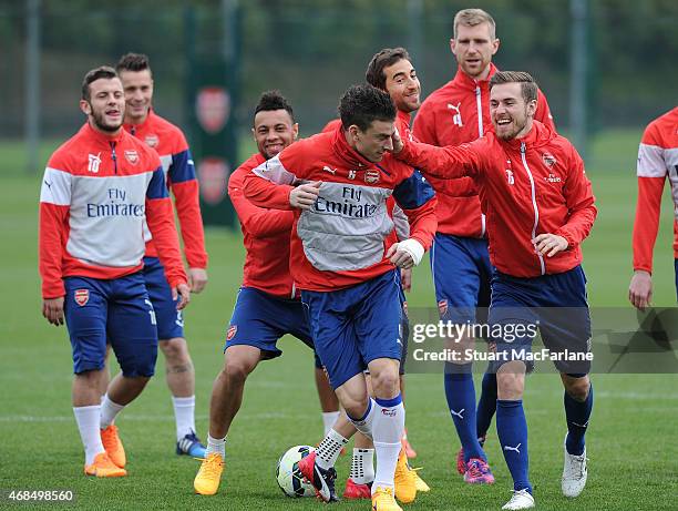 Jack Wilshere, Francis Coquelin, Laurent Koscielny and Aaron Ramsey of Arsenal during a training session at London Colney on April 3, 2015 in St...