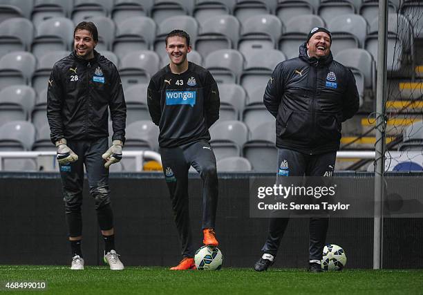 Goal Keepers Tim Krul and Freddie Woodman laugh with Goal Keeping Coach Andy Woodman during a Newcastle United Training session at St.James' Park on...