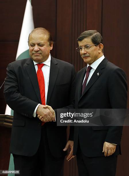 Turkish Prime Minister Ahmet Davutoglu and Pakistani Prime Minister Nawaz Sharif shake hands after their joint press conference at the Prime Ministry...