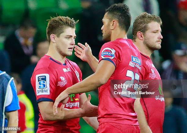Karmichael Hunt and James OConnor of the Reds embrace after the Reds lost during the round eight Super Rugby match between the Rebels and the Reds at...