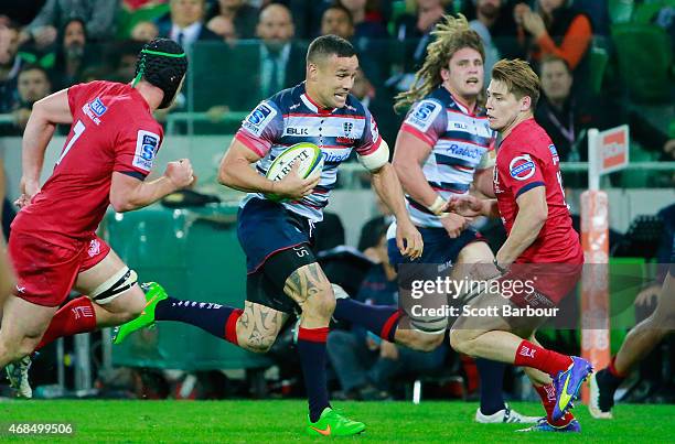 Tamati Ellison of the Rebels runs with the ball during the round eight Super Rugby match between the Rebels and the Reds at AAMI Park on April 3,...